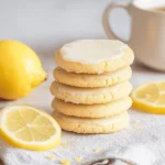 Stack of keto lemon sugar cookies on rustic table