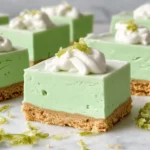 No-Bake Key Lime Fluff Bars with whipped cream and graham cracker crust
